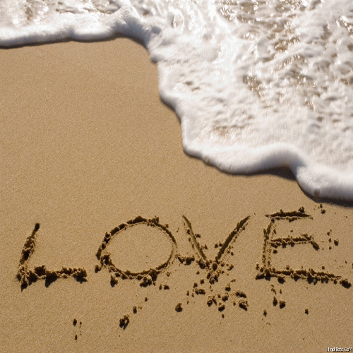 Love word in sand on beach